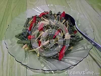 papaya leaves and long beans Stock Photo