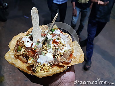 Papdi chaat indian spice hand held salty and sweet Stock Photo