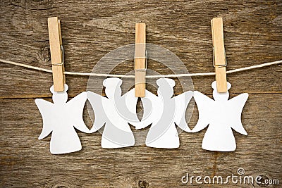 Paper angels hanging on the clothesline Stock Photo