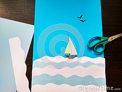 Paper application of a sailboat on the sea and seagulls Stock Photo