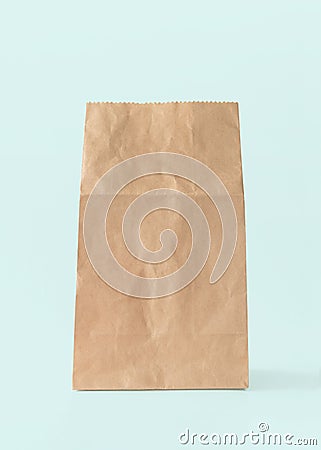 Paper bag isolated on white blue background with clipping path, eco-friendly brown food package mockup for lunch, breakfast Stock Photo