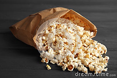 Paper bag with tasty popcorn Stock Photo