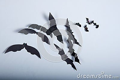 Paper bats on the white cloth Stock Photo