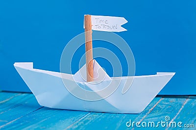 Paper Boat with a sign Time to travel - travel concept Stock Photo