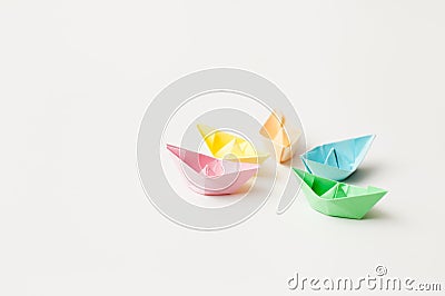 Paper boats from color paper on white Stock Photo