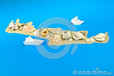 Paper boats off the coast of Crete Stock Photo