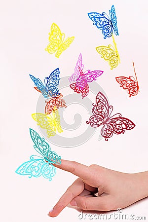 Paper butterflies fly out of girls hands Stock Photo
