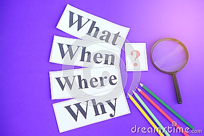 Paper cards with Wh-question words and question mark Stock Photo