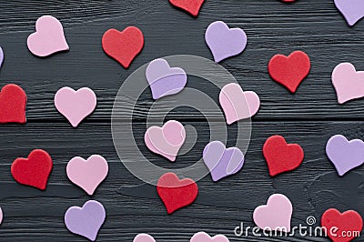 Paper colored hearts on grey wooden background Stock Photo
