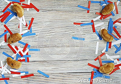 Paper confetti of the national colors of France, white-blue-red on a white wooden background with flags, concept Bastille day, Jul Stock Photo