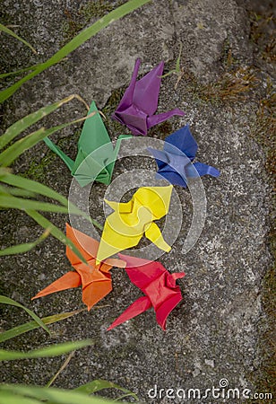 Paper cranes of the colors of the LGBT community. A symbol of freedom and equality is a paper crane in the colors of the Stock Photo