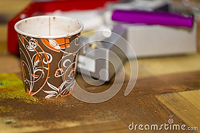 A paper cup with coffee and a ashtray Stock Photo