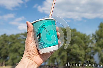 Paper cup with coffee and the inscription donate Stock Photo