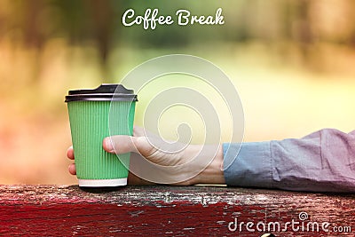 Paper cup of coffee outdoors, coffee break banner Stock Photo