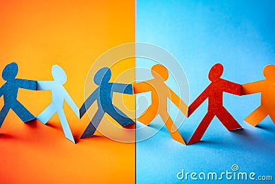 Paper cut concept - multicultural cooperation of the two groups Stock Photo