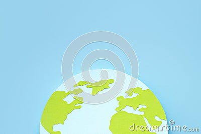 Paper-cut hemisphere of the globe with continents on a blue background. Earth day concept Stock Photo