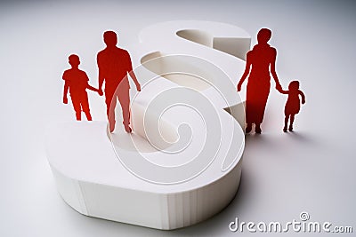 Paper Cutout Of A Separated Family With Paragraph Sign Stock Photo