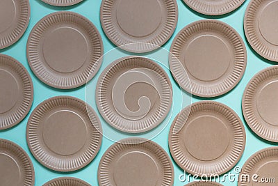 Paper disposable plate pattern on pastel blue background. Summer party, kitchen cutlery Stock Photo