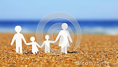 Paper Family on the beach. Family Stock Photo