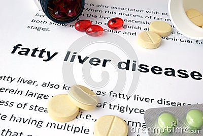 Paper with fatty liver disease and pills. Stock Photo