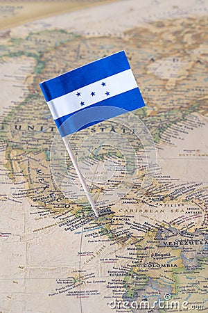 Honduras flag pin on a world map Stock Photo