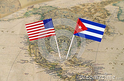 The United States of America and Cuba flag pins on a world map, political relations concept Stock Photo