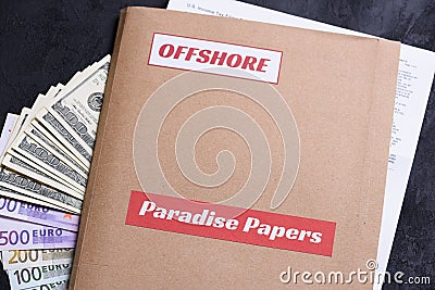 Paper folder with Paradise papers and offshore label on it Stock Photo