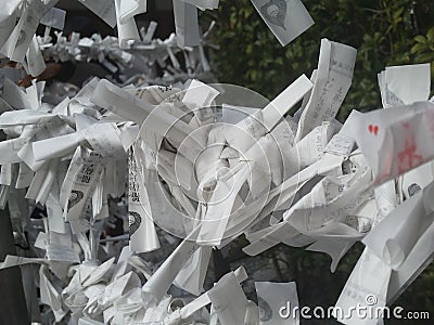 Paper fortunes left behind and blowing in the wind Stock Photo