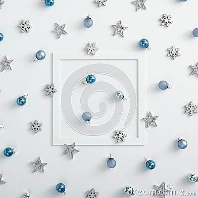 Paper frame with blue bauble, silver snowflake and star over white Stock Photo