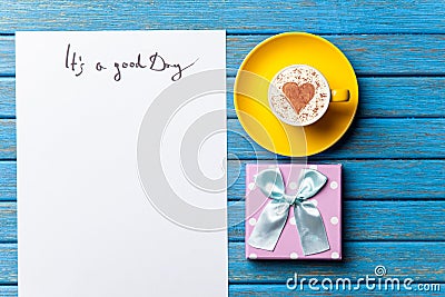 Paper, gift, coffee and laptop lying on the table Stock Photo