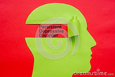 Paper head with a torn part and inscription Persistent depressive disorder PDD. Stock Photo