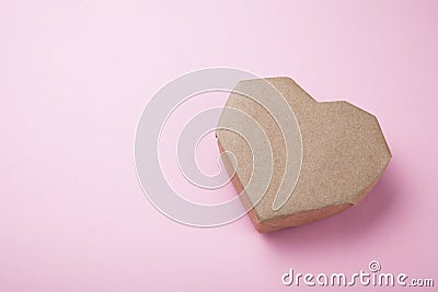 Paper heart made from recycled paper on a pink background, empty space for text Stock Photo