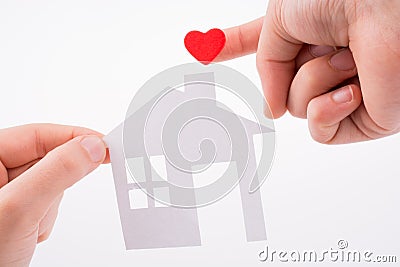 Paper house and heart shape Stock Photo