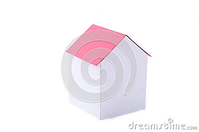 A paper house with red roof on a white background Stock Photo