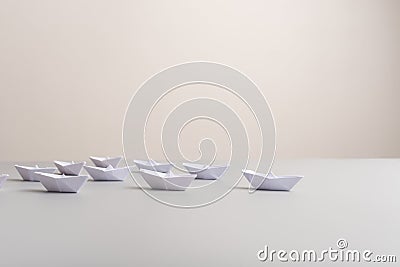 Paper made origami boats positioned in a pyramid shape Stock Photo