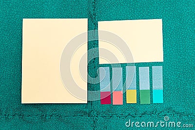 Paper memo stick on green wall background. Stock Photo