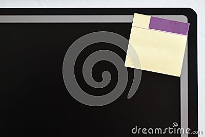 Paper memo sticker in the corner of the monitor screen Stock Photo