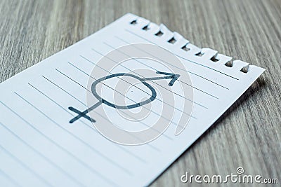 Paper note with gender of LGBTQ symbol for Lesbian, Gay, Bisexual, Transgender and Queer community Stock Photo