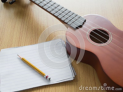 Paper note with Ukulele, Concept for music writing Stock Photo