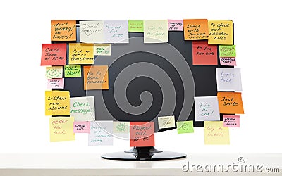 Paper notes on computer monitor Stock Photo