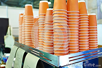 Paper orange cups for tea in cafe Stock Photo