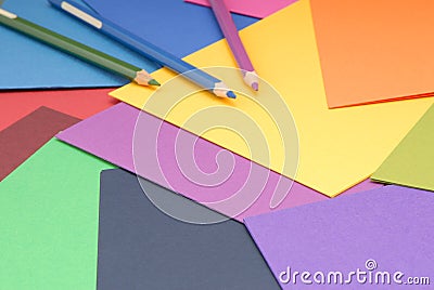 paper and pencils for artwork, color palette of paper, multicoloured paper background, multicolour paper and coloured pencils Stock Photo