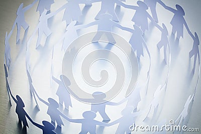Paper people holding hands Stock Photo