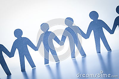 Paper people standing together hand in hand. Team, society, business concept Stock Photo