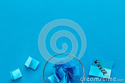 Paper pieces - random winner selection - blue desk top-down copy space Stock Photo