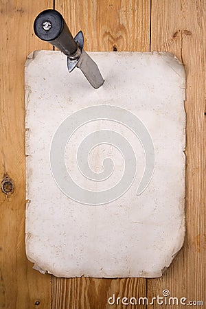 Paper pinned with a knife Stock Photo