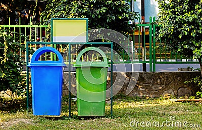 Paper and plastic recycle bin placed in the garden for cleanness. cleanness concept Stock Photo