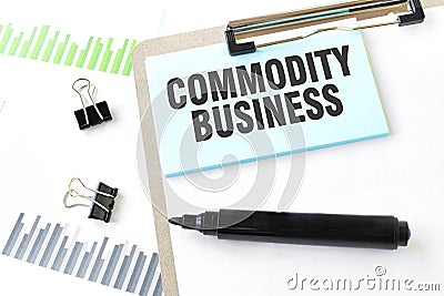 Paper plate, marker, diagram, chart and office tools. Text COMMODITY BUSINESS Stock Photo