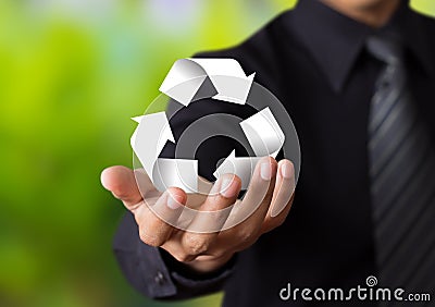 Paper recycle sign in businessman hand Stock Photo