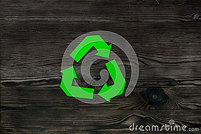 Paper recycling simbol on wooden desk top view copyspace Stock Photo